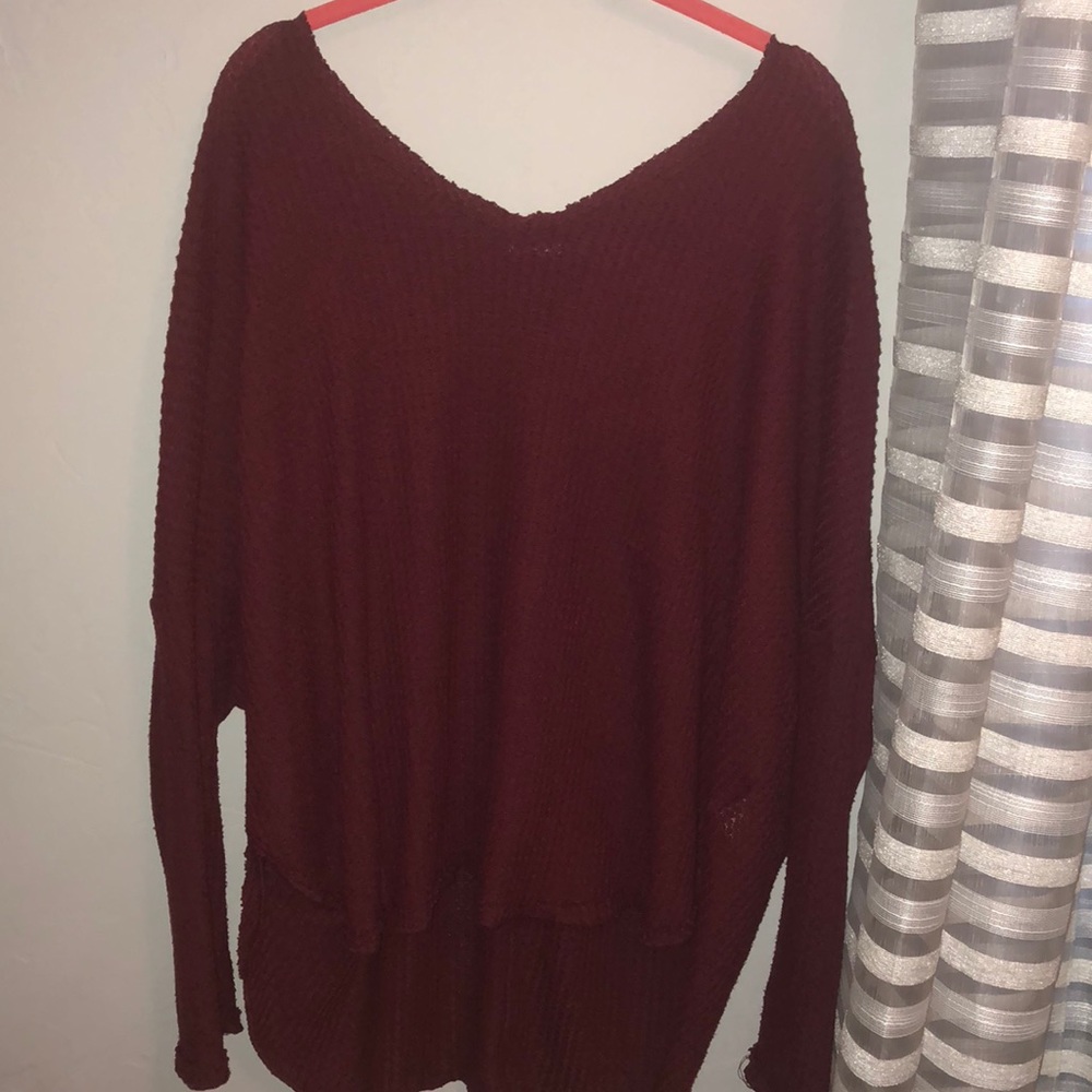 Maroon wide v-neck flowy shirt.